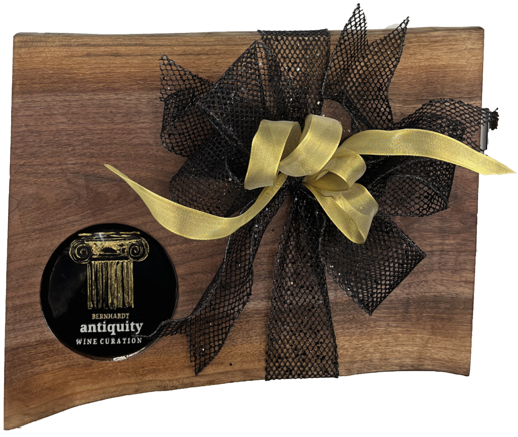 Contemporary Live edge Walnut hard wood board featuring 3D printed Logo for Bernhardt Winery’s “Antiquity wines” encased in food grade resin. Elegant black and Gold artwork. This truly is where art meets function in a spectacular way.